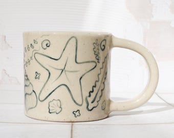 Handmade Stoneware Coffee Mug: 335ml Hand-Painted Shell illustration