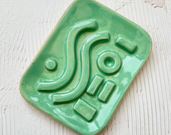 wonky soap dish with some glaze defects - green geo soap dish