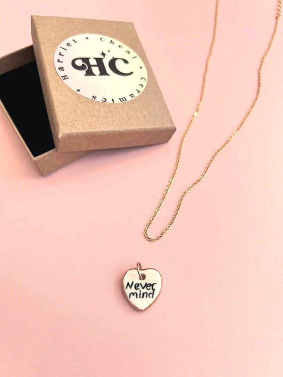 Handmade Ceramic Heart Pendant: ; 'Never mind', Gold Lustre Edge