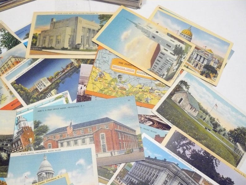 May include: A collection of vintage postcards featuring various buildings and landmarks. The postcards showcase architectural styles and include images of government buildings, churches, and maps. The color palette includes shades of blue, beige, and brown.