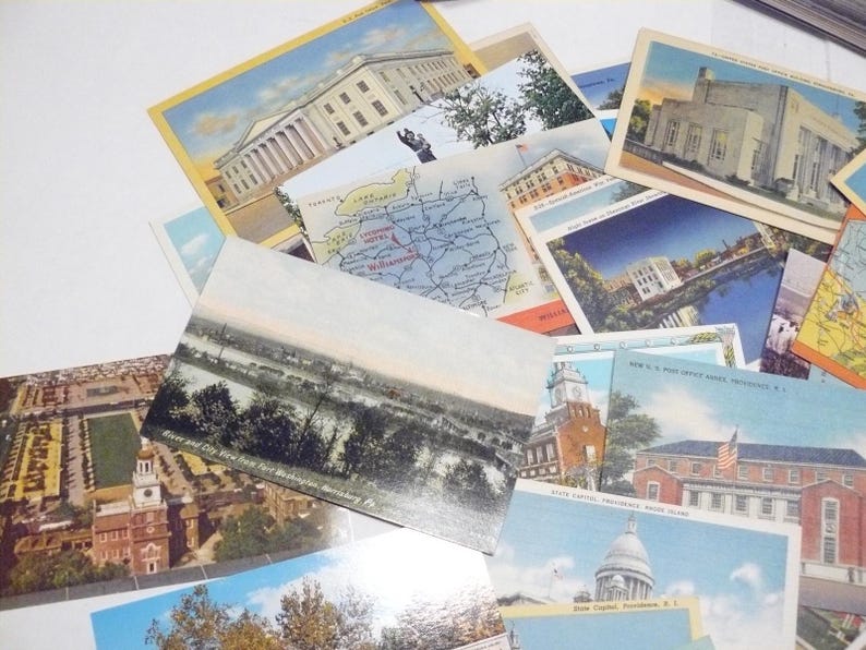 May include: A collection of vintage postcards featuring various architectural landmarks, maps, and scenic views. The postcards showcase buildings, rivers, and cityscapes, with a variety of colors and styles. Some postcards have text, including place names.