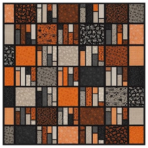 May include: A patchwork quilt featuring a grid of rectangular and square fabric blocks in a color palette of black, orange, and light gray. The fabric patterns include spider webs, small dots, checkered prints, and various seasonal motifs.