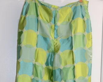 May include: Green and blue patterned trousers with a high waist and a straight leg.
