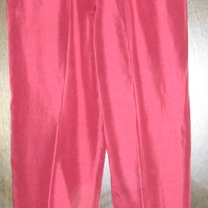 May include: A pair of red sweatpants with a drawstring waist.