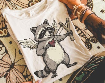 Cupid Raccoon Valentine Tee | Cute Love Raccoon Shirt | Funny Animal Valentine T-Shirt | Unisex Graphic Tee