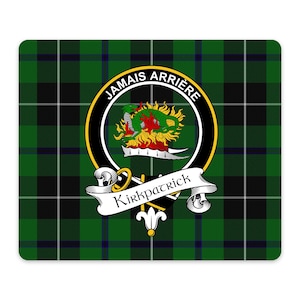 May include: A rectangular mouse pad featuring a green, black, and white tartan plaid pattern. Centered is a circular crest with a black border, gold trim, and the text JAMAI ARRIÈRE. Inside is a green dragon on fire above the name Kirkpatrick.