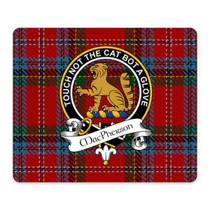 May include: A rectangular mouse pad featuring a red, green, and blue tartan plaid pattern. Centered is the MacPherson clan crest with a gold cat, a black circular belt with the text TOUCH NOT THE CAT BOT A GLOVE, and a white banner reading MacPherson.