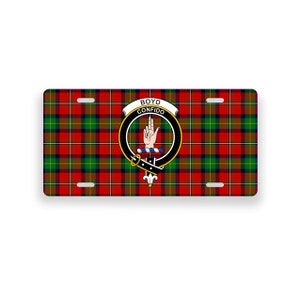 May include: A red, green and black tartan licence plate featuring the Boyd clan crest and the text "Boyd Confido" in a white banner.