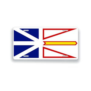 May include: A white rectangular license plate with the flag of Newfoundland and Labrador. The flag features a red and white cross with a yellow diagonal stripe.