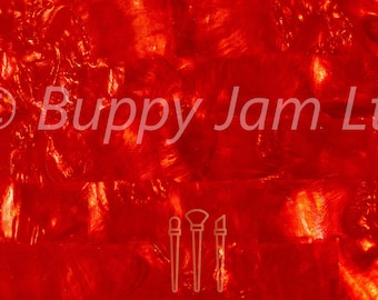 May include: Red iridescent sheet of material with a textured surface. The material has a shimmering, pearlescent quality. The text "Burppy Jam Ltd" is visible in the center of the image.