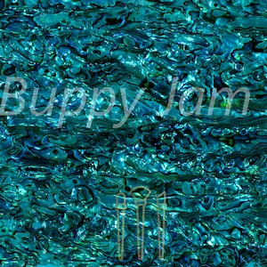 May include: Abstract background with a swirling pattern in shades of teal and blue. The surface has a shimmering, iridescent quality, with the text "© Bupyy Jam Ltd" in the upper left corner.