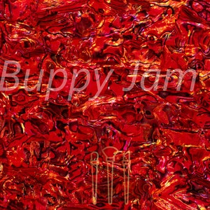 Puede incluir: Fondo abstracto y texturizado en tonos rojos, naranjas y dorados. La superficie parece brillante y desigual, con un patrón de formas arremolinadas. El texto "© Buppy Jam Ltd" es visible en blanco. La imagen también contiene un gráfico de tres pinceles.