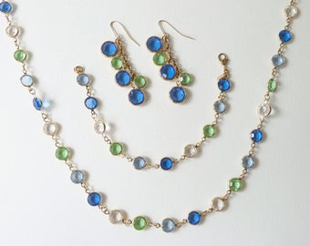 Vintage Monet demi parure bezel crystal chain necklace, bracelet and earring set, clear, green, blue bezel gold link jewellery set.