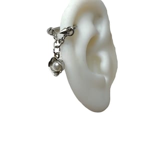 Helix piercing with flower and pearl