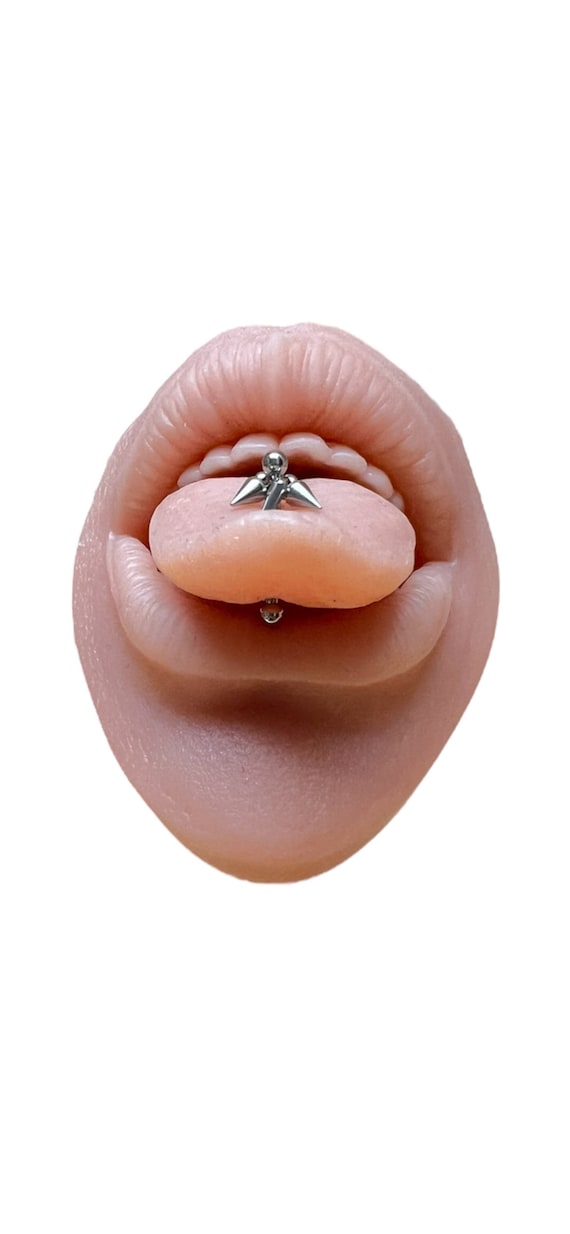 Tongue piercing , Tongue jewelry with spike