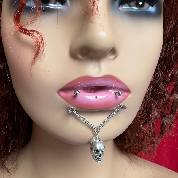 Demon horses shoe lips , with Skull ,Vampire lips piercing , Snake piercing