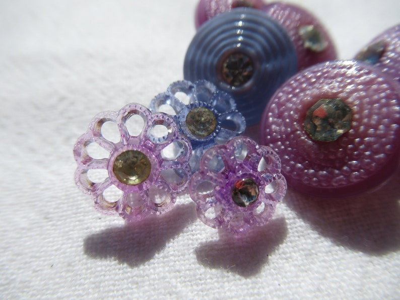 58 slight dome top Blue flowers with rhinestones Purple and Blue buttons with rhinestone center Purple flower with rhinestone center