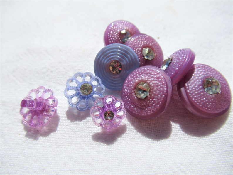 58 slight dome top Blue flowers with rhinestones Purple and Blue buttons with rhinestone center Purple flower with rhinestone center