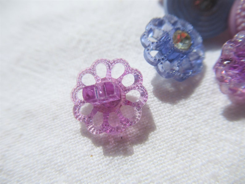 58 slight dome top Blue flowers with rhinestones Purple and Blue buttons with rhinestone center Purple flower with rhinestone center