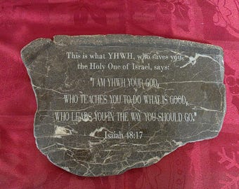 Stone slab sign that says Isaiah 48:17