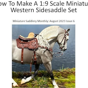 May include: A miniature model of a gray horse with a Western sidesaddle set. The saddle is brown with intricate tooling, and the horse has a white mane and tail. The image includes text that reads "How To Make A 1:9 Scale Miniature Western Sidesaddle Set."