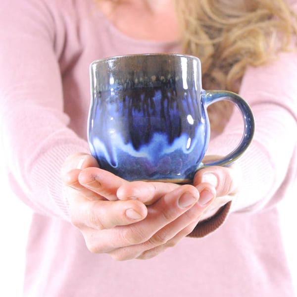 handmade rustic pottery mug. ceramic mug. handmade coffee cup. flowing deep blue glaze. handmade in ithaca. under the tree.