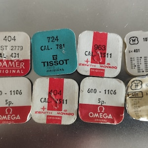 set Vintage Swiss Watch 12 parts Winding stems. Green Tissot pack is empty.