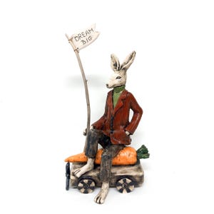 Dream Big – Whimsical Ceramic Rabbit Sculpture on Carrots Wagon – OOAK Art Doll by Izabel Nemechek, Inspirational Art