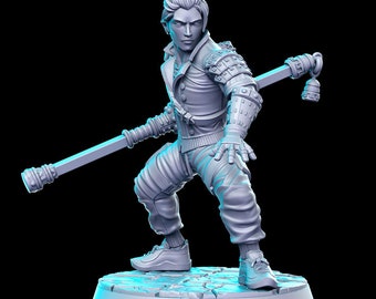May include: A gray painted miniature figurine of a person holding a staff. The person is wearing a jacket and pants. The figurine is standing on a gray base.