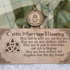 May include: A wooden sign featuring a Celtic knot design and the inscription "Celtic Marriage Blessing". The sign displays a traditional Irish blessing wishing happiness and prosperity to the couple.