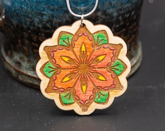 Red mandala flower hand-painted etched wood pendant attached to a white chain. gifts for wife. wood jewelry gift.