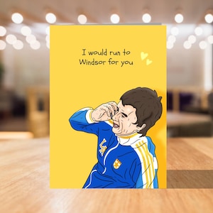 May include: A yellow greeting card with a cartoon illustration of a man in a blue and yellow football kit. The card reads "I would run to Windsor for you" with two small hearts.