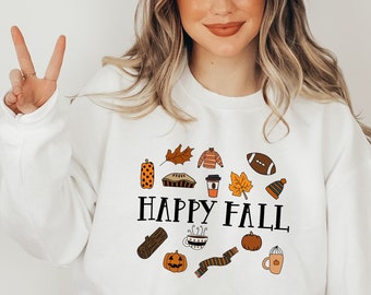 Puede incluir: Sudadera blanca con un diseño gráfico de iconos de otoño y el texto "Happy Fall".
