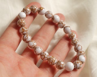 Gemstone bracelet white beads with gold speckles • Natural stone