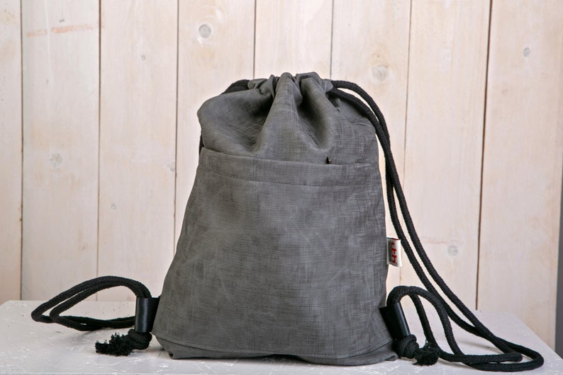 Drawstring bag in Vegan waterproof material back pack with pockets rucksack  school bag lightweight woman men unisex for travel festival