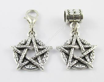 May include: Two silver-toned pentagram charms, one with a lobster clasp and the other with a bead cap. Both charms feature a five-pointed star within a circle.