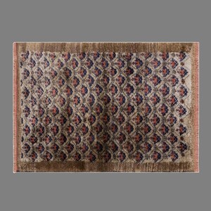 May include: A rectangular rug with a repeating diamond pattern in shades of brown, red, and navy blue. The rug has a brown border and fringe along the edges. The rug's design is symmetrical and detailed.