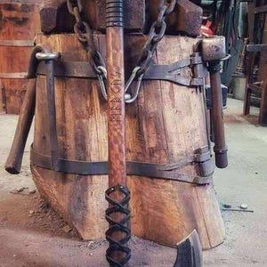 Hand-forged Viking bearded axe made of carbon steel, with straight shaft, leather wrapping and in various versions