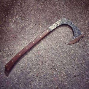 Hand-forged outdoor axe &quot;Predator&quot; made from a single piece of carbon steel, in a very unusual shape