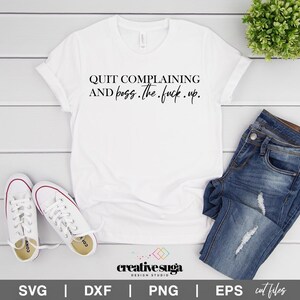May include: White t-shirt with the text "QUIT COMPLAINING AND boss. The fuck.up." in black script. The shirt is paired with blue jeans and white sneakers. The image also includes the "creative suga DESIGN STUDIO" logo.