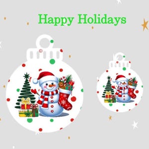 May include: Two white Christmas ornament designs with a snowman, Christmas tree, and gifts. The snowman wears a red hat and scarf. The ornaments have red and green polka dots. The words "Happy Holidays" are in green.
