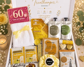 May include: A 60th birthday gift box containing a white towel with a yellow ribbon, a honey peel-off mask, two 30 ml pouches, gold eye masks, a yellow scrunchie, a soap bar, two Twinings tea bags, a Galaxy chocolate bar, and a cookie snack pack.