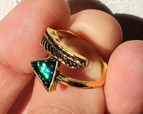 Emerald green ring.