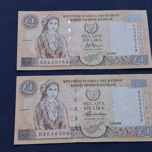 2 Cyprus 1 pound banknotes dated 2001 and 2004
