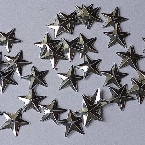 100 Approx silver coloured shimmering metallic sequin stars - Christmas etc