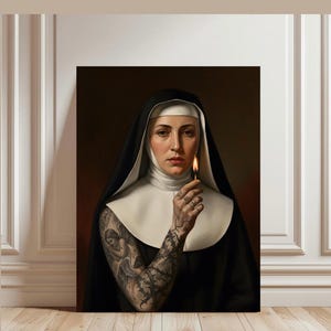 May include: A canvas print featuring a nun in a black habit and white wimple, holding a lit match. The nun's arm is covered in intricate tattoos. The artwork is displayed against a neutral background.
