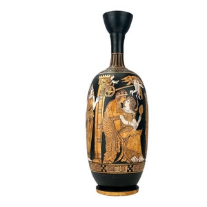 May include: Black and gold ceramic vase with a scene of Greek mythology painted on the side. The vase is decorated with a black and gold geometric pattern around the bottom.