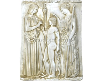 May include: A rectangular off-white wall plaque featuring a relief sculpture of three figures in draped garments. The central figure stands between two taller figures, one of whom touches the central figure's head. The text greekartshop is visible.