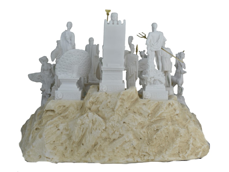 May include: White marble sculpture of the Greek gods and goddesses on a rocky base. The sculpture features figures of Zeus, Hera, Poseidon, Athena, Apollo, Artemis, Aphrodite, Ares, Hermes, and Hephaestus.