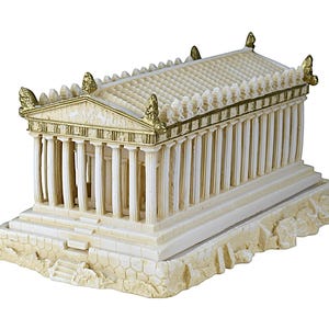 May include: A detailed ivory-colored miniature replica of an ancient Greek temple, featuring numerous columns, a sloped roof, and gold accents. The model sits on a textured base, showcasing architectural details.